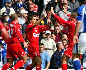 Michael Owen celebrates with Danny Murphy and Steven Gerrard after scoring against Everton  on 15 September 2001