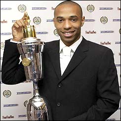 Thierry Henry displays his PFA Player of the Year trophy