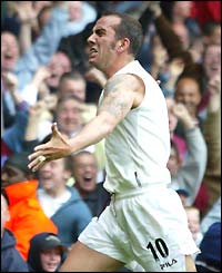 Paolo di Canio celebrates without his shirt after scoring West Ham's goal