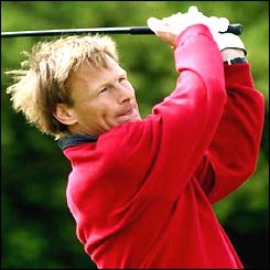 Teddy Sheringham takes a swing  