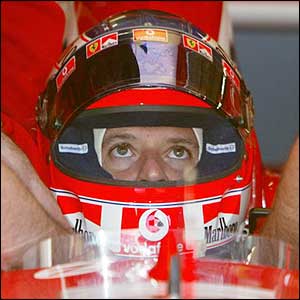 Brazil's Rubens Barrichello sits in his Ferrari in the pits