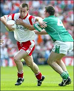 Tyrone's Brian McGuiganand  Fermanagh's Michael Lilly 