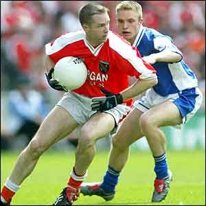 Armagh's Andrew McCann and  Laois midfielder Ross Munnelly
