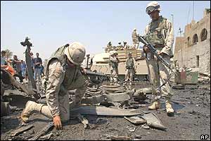 US soldier collect evidence at blast scene