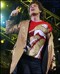 Rolling Stones lead singer Mick Jagger  bounds around the stage 