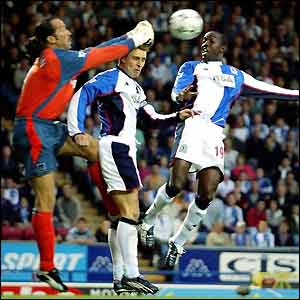 City keeper David Seaman is put under pressure in the box 