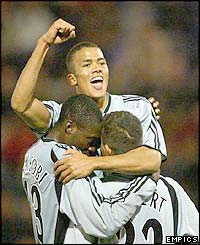 Newcastle's players celebrate Laurent Robert's goal