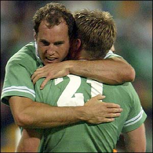 Girvan Dempsey  hugs Ronan O'Gara at the whistle 