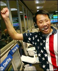 Landing Chief Engineer Wayne Lee whoops for joy  as the signal from the Mars Rover Spirit is received.