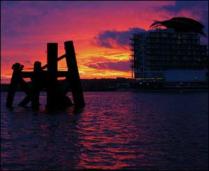 Winter sunset at Cardiff bay, with the St David's Hotel overlooking a silhouetted reminder of Cardiff's past (Malcolm Harvey)