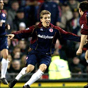 Juninho scores twice in four minutes as Boro take a 2-1 lead into the interval  at Old Trafford