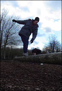 Ben balancing on the log at Cosmeston Lakes Country Park, as captured by John Parker from Cardiff