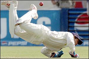 Indian wicket-keeper Patel dives for but  misses a shot by Yousuf Youhana 