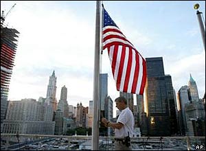 Merrill Lynch employee Michael George lowers US flag to half-mast   