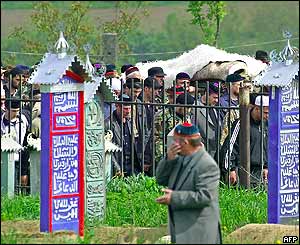 Funeral procession arrives at cemetery  