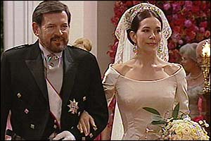 Bride Mary Donaldson walks down the aisle with her father John, 14 May 2004