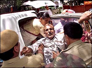 Police detain a group of Congress Party supporters during a demonstration against outgoing Health and Parliamentary Affairs Minister Sushma Swaraj.
