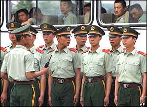 Chinese paramilitary police prepare to patrol in Beijing's Tiananmen Square,  June 4, 2004  