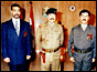 Uday and Qusay Hussein with their father (copyright: AP)