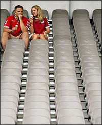 Two Denmark fans enjoy some refreshments in the Braga Municipal stadium as kick-off against Bulgaria approaches