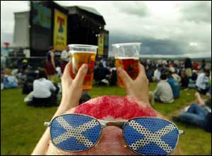 Raising your glasses - One festival-goer really getting in the spirit