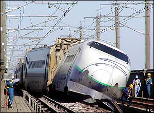 The Shinkansen train lies derailed in Nagaoka, north-western Japan