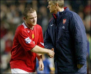 Rooney and Wenger enjoy a token handshake after the youngster's massive contribution to the final outcome of the game