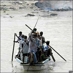 People cross by boat in  Nagappattinam port