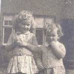 Joan and her sister Gillian outside their house in Shooters Hill, London.  Note the blast damaged windows.  The house was later made uninhabitable by bombing.