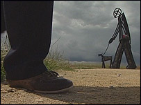 Foot and walker statue on Byron walk