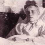 Jack sitting up in his hospital bed, probably on or about 21st May 1944.  You can see the scar on the left side of his head, showing where the incision was made to remove the bullet.