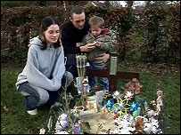 Kelly & Gavin at Brandon's grave, with son Connor