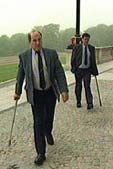 Image of two victims with walking sticks