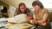 Owner Diana with Bruce looking through old records.