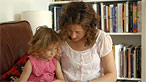 Woman reading to young girl Woman reading to young girl
