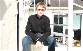 Jay Hutchinson sitting on stairs nice day