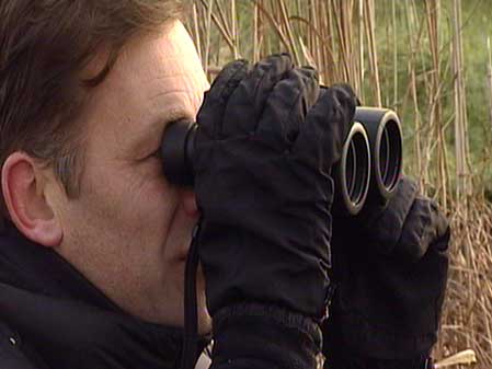 Chris Packham with binoculars