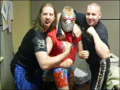 Howard Bentham with two wrestlers