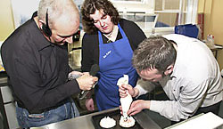 Paula supervises Ronan's culinary efforts