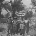 Written on the back of this photograph is "Taken outside the hangar we sleep in at Basra, 13/10/41".    Wilfred Hill is on the left.