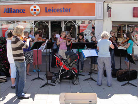 Street musicians in Hereford city centre during the Three Choirs Festival.
