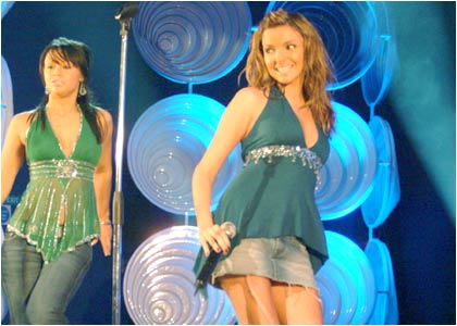 Girls Aloud on stage at the R1 / TOTP Christmas Party