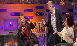 Louis Walsh surprises Graham Norton as Sharon Osbourne looks on