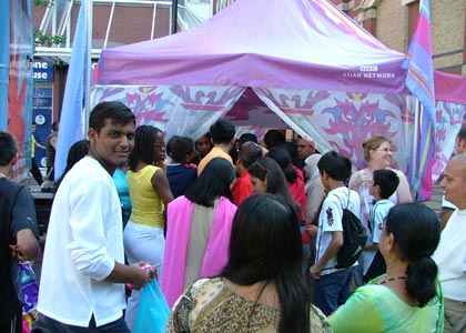 The crowd queue outside the marquee to snap up the goodies