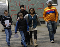 Blue Peter presenters Konnie Huq and Hardeep Kohli greet the boys