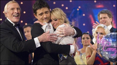 Brucie congratulates the pair 