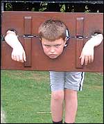 Pic: Boy in stocks.
