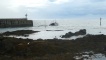 A boat leaves the harbour at Pittenweem