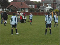 Girls playing football