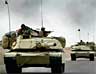 A convoy of US Army 3rd Infantry M1A1 Abrams tanks cross the Euphrates river as hundreds of armored vehicles push towards the outskirts of Baghdad on 6 April 2003